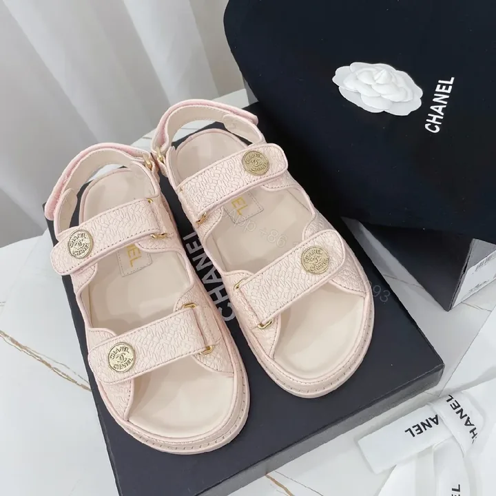 View 1 of Soft Pink Textured Sandals with Gold Button Accents