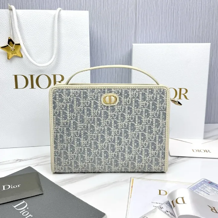 View 1 of Textured Monogram Carryall: Structured Luxury Handbag