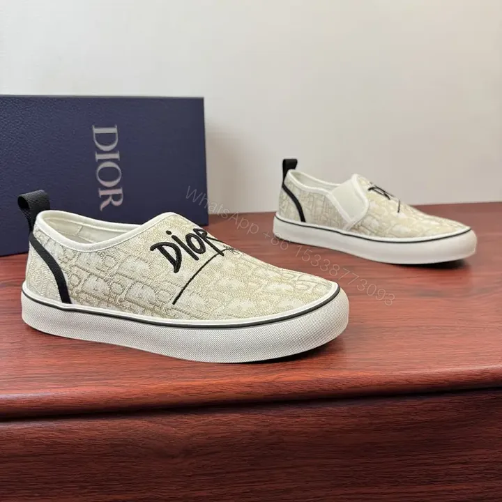 View 1 of Beige Canvas Slip-On Sneakers with Logo
