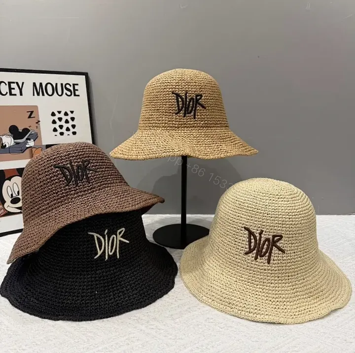 View 1 of Chic Straw Bucket Hat – Embroidered Logo, Breathable Style