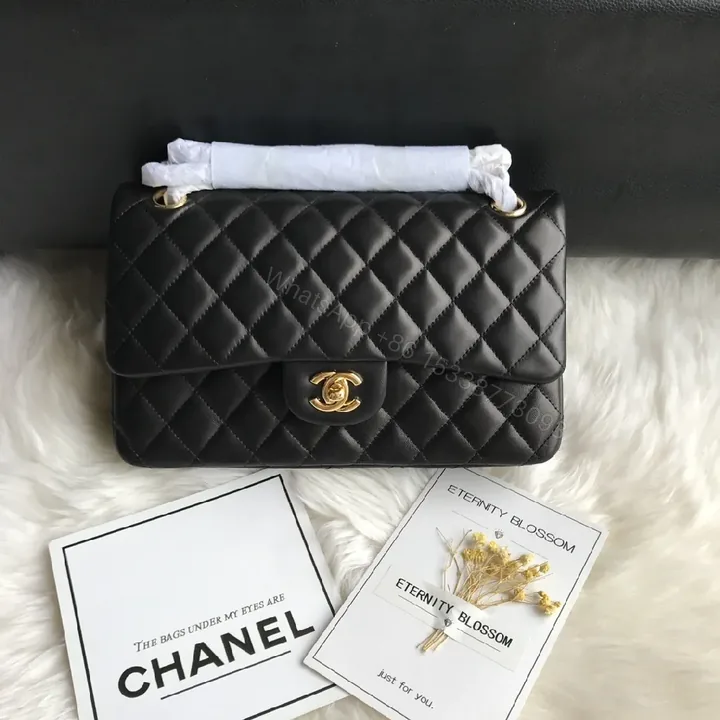 View 1 of Quilted Black Handbag with Gold Clasp – Luxe Chic Style