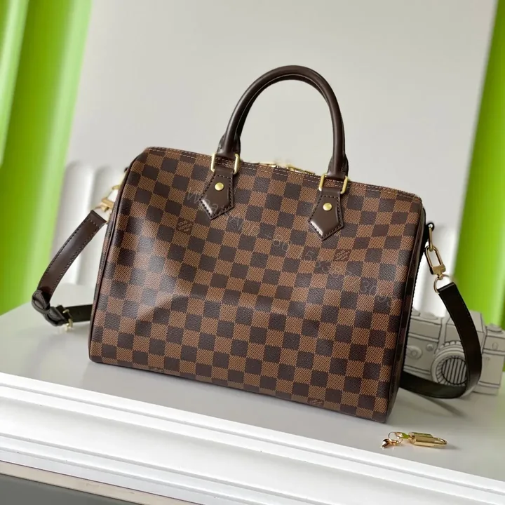 View 1 of LV SPEEDY BANDOLIÈRE 30 IN DARK BROWN DAMIER EBENE CANVAS GOLD LOCK