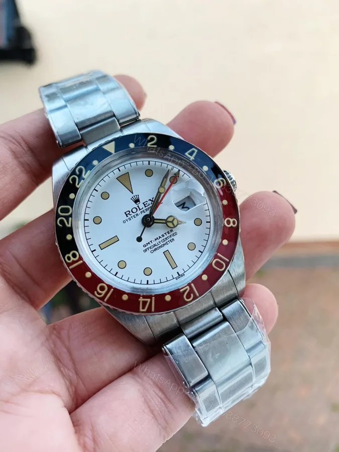 View 1 of VINTAGE Rolex GMT Master 6542 Black/Red Bezel White Dial A2836