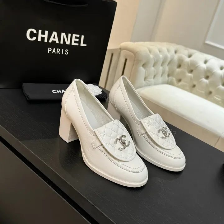 View 1 of Cream Leather Quilted Loafers with Signature Detail - Slip-On Style