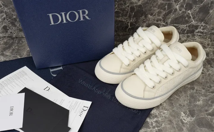 View 1 of White Leather Minimalist Low-Top Sneakers with Luxe Trim