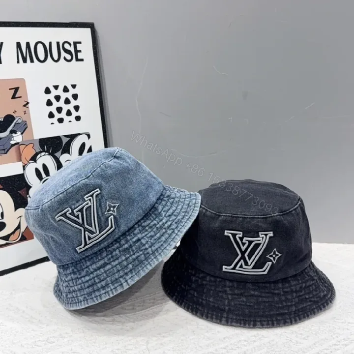 View 1 of Denim-Textured LV Logo Bucket Hat: Modern Luxury Comfort
