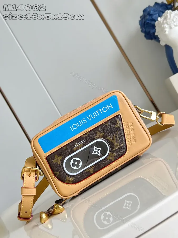 View 1 of Compact Luxury Crossbody: Monogram Canvas with Blue Accent and Gold Hardware