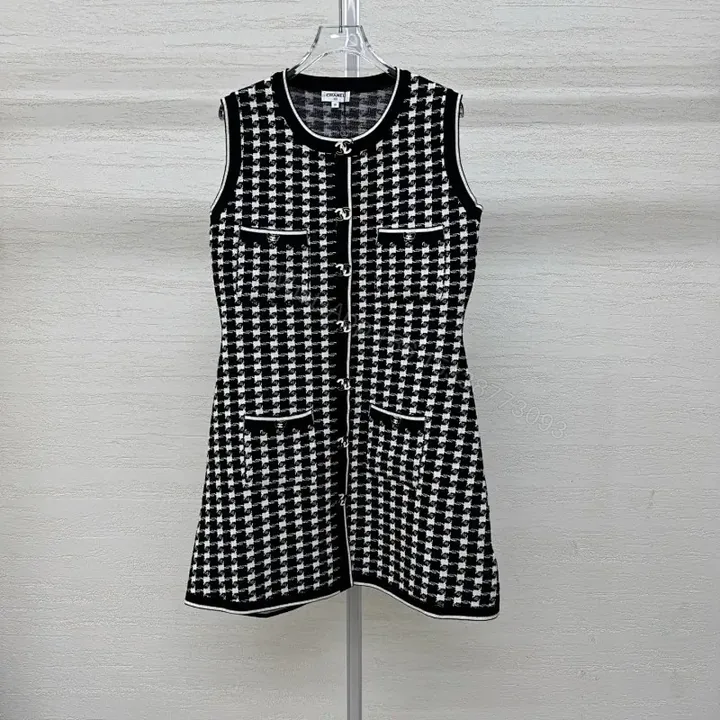 View 1 of Chic Textured Sleeveless Dress with Bold Houndstooth Pattern