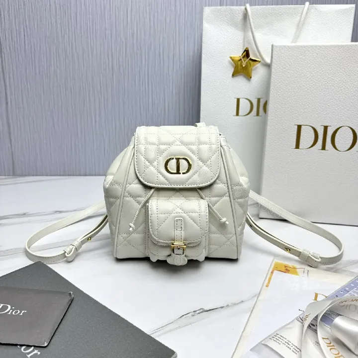 View 1 of Quilted White Mini Backpack with Gold Hardware - Compact Luxury