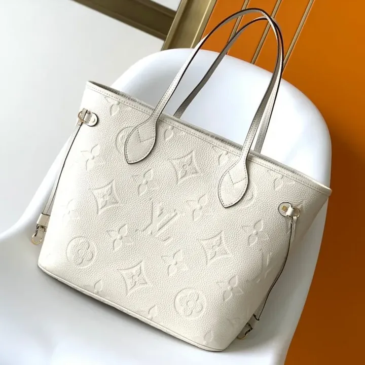 View 1 of LV NEVERFULL MM WHITE MONOGRAM EMPREINTE LEATHER