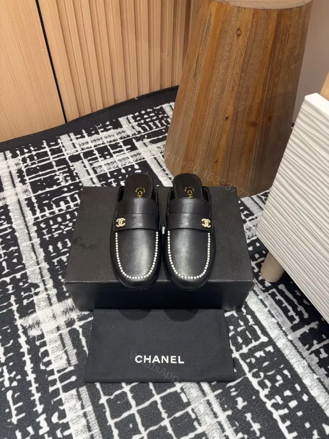 View 1 of Pearl-Trim Leather Mules – Black, Gold Hardware, Luxury Style
