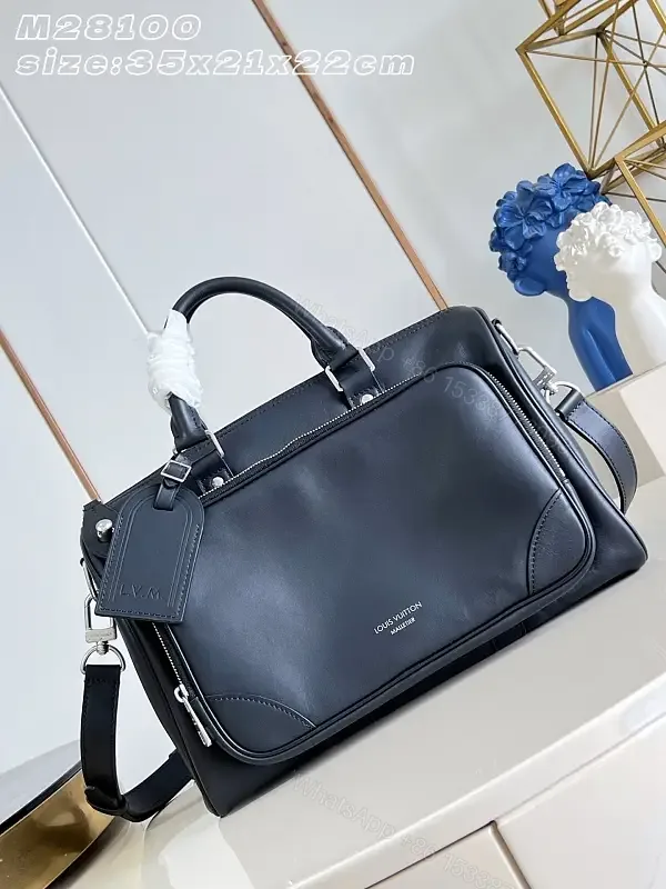 View 1 of Black leather structured satchel with top handle, removable strap, smooth finish, Louis Vuitton Paris (no brand details)