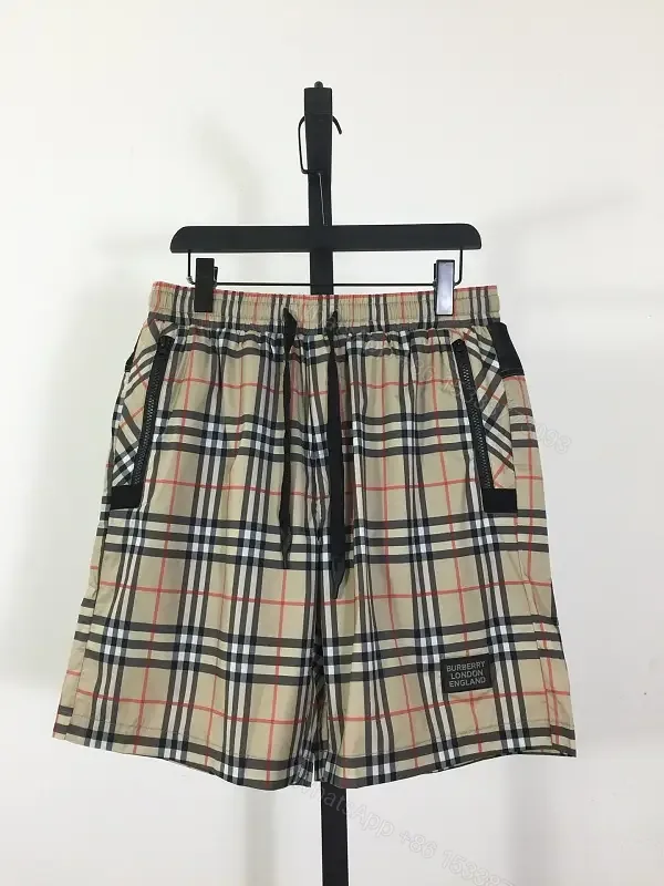 View 1 of Beige Cotton Burberry Check Shorts with Drawstring