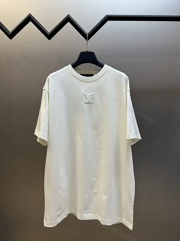 View 1 of Oversized White Tee with Subtle Embossed Logo - Minimal Luxury
