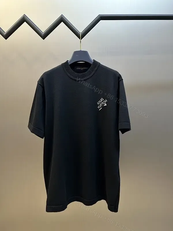 View 1 of Minimalist Black Crewneck Tee Dress – Subtle Logo, Versatile Dress