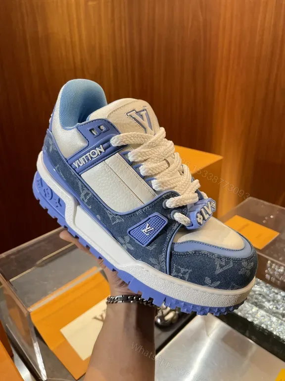 View 1 of Bold Denim-Inspired Trainer with LV Accents - Luxe Casual Sneakers