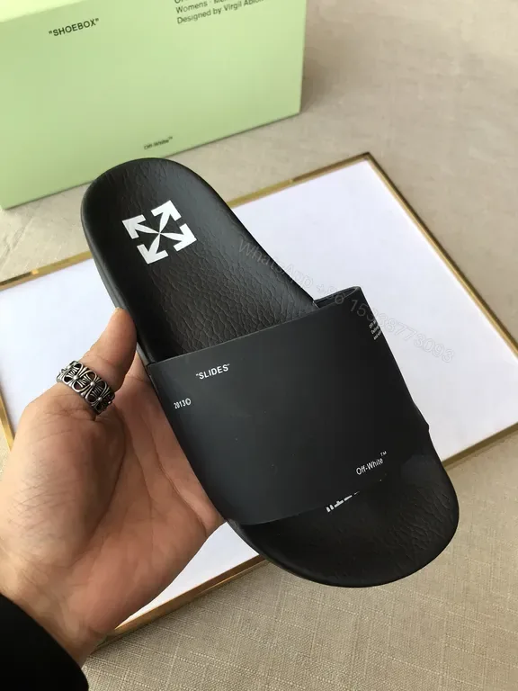 View 1 of Minimalist Black Faux-Leather Slip-Ons: Iconic Texture Slides