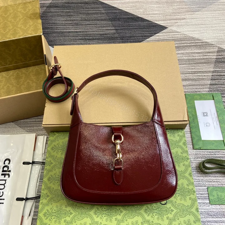 View 1 of JACKIE SMALL SHOULDER BAG 27 IN WINE RED CRACKED LACQUER CALFSKIN GOLD HARDWARE