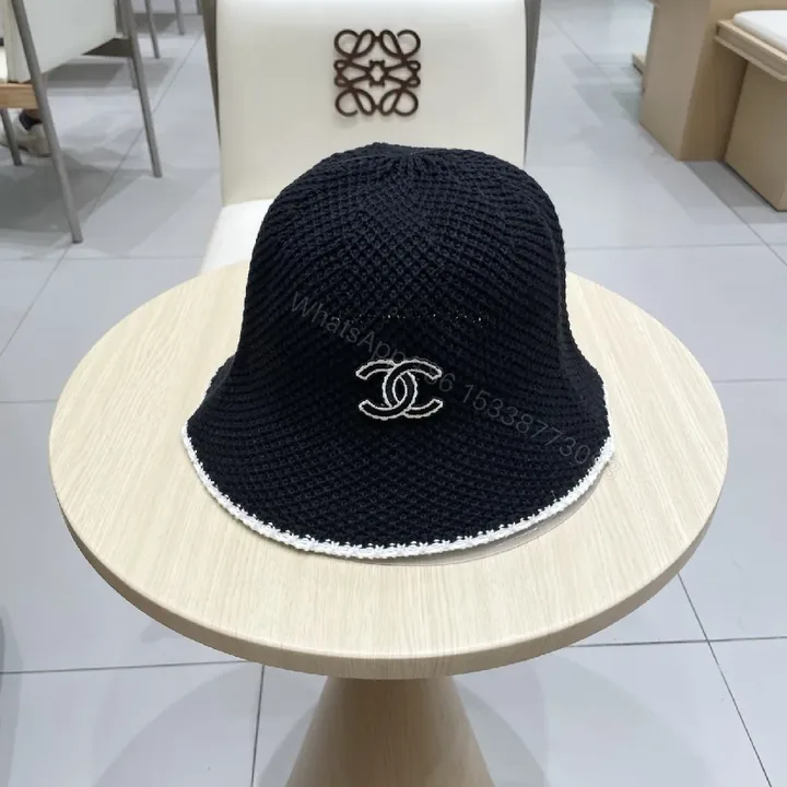 View 1 of Black Knit Bucket Hat – Luxe Parisian-Style with Subtle Emblem
