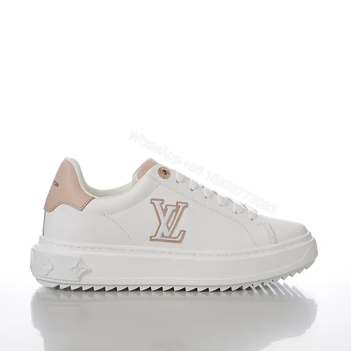 View 1 of Polished Everyday Comfort: White Leather Sneaker with Blush LV Accent