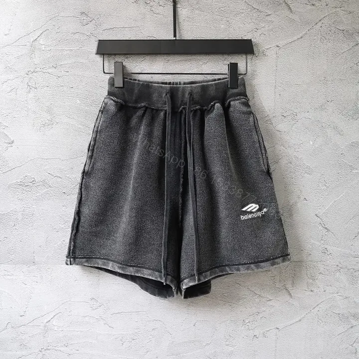 View 1 of Black Denim Drawstring Shorts - Balenciaga Logo Style