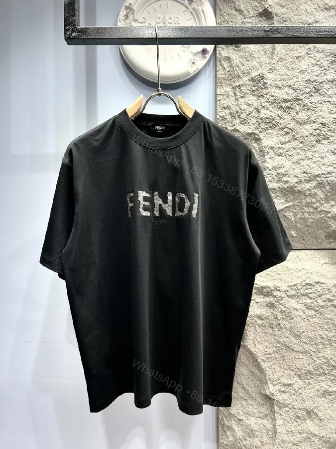 View 1 of Minimalist Black Cotton Tee with Elevated Logo Texture