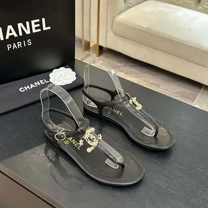 View 1 of Minimalist Black Leather Sandals with Gold Charms - Elegant Comfort