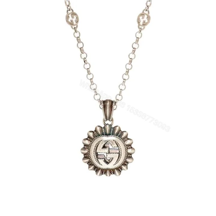 View 1 of GUCCI INTERLOCKING G LOGO EMBELLISHED PENDANT STATION NECKLACE GOLD TONE
