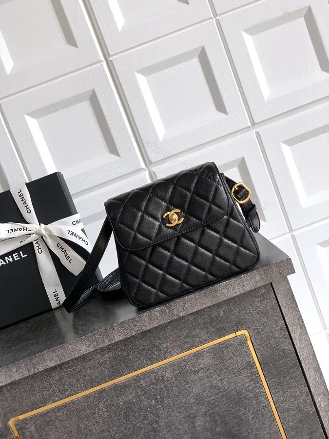 View 1 of Compact Quilted Black Camera Bag with Gold Hardware