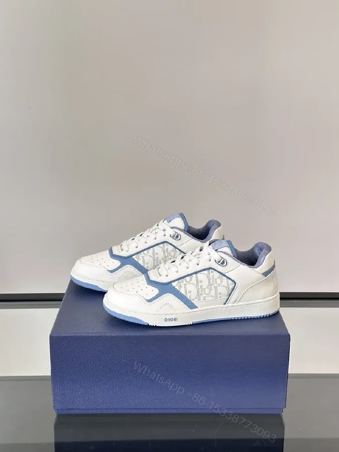 View 1 of White & Sky Blue Leather High-Tops with Subtle Monogram Texture