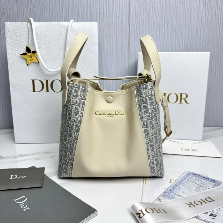 View 1 of Cream Leather & Denim-Inspired Bucket Bag, Structured Luxury