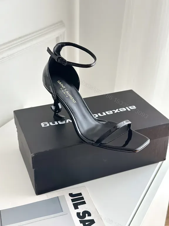 View 1 of Chic Black Patent Strappy Sandal by Saint Laurent - Elegant City Heel