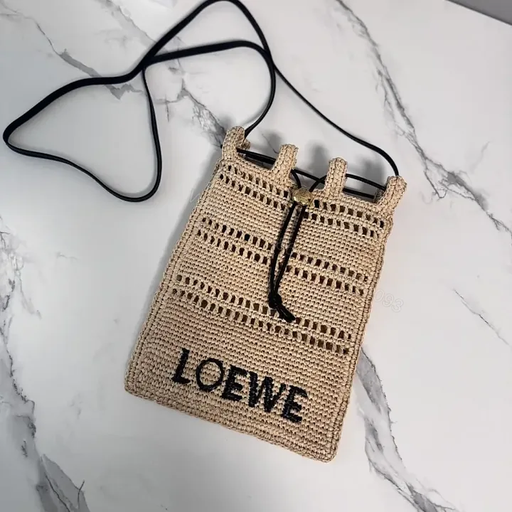 View 1 of Beige Straw Crochet Bag with LOEWE Logo Drawstring Tote