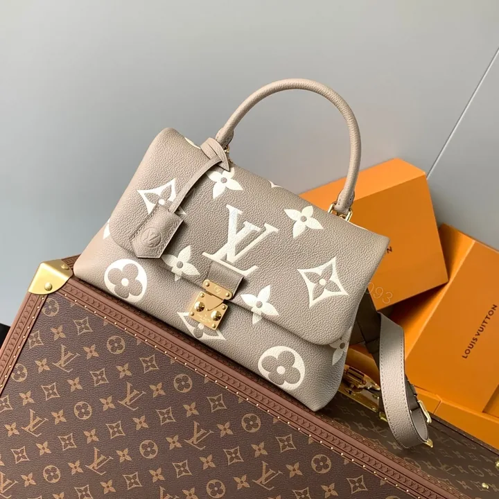View 1 of LV MADELEINE 30 IN BEIGE MONOGRAM CALFSKIN EMBOSSED LOGO