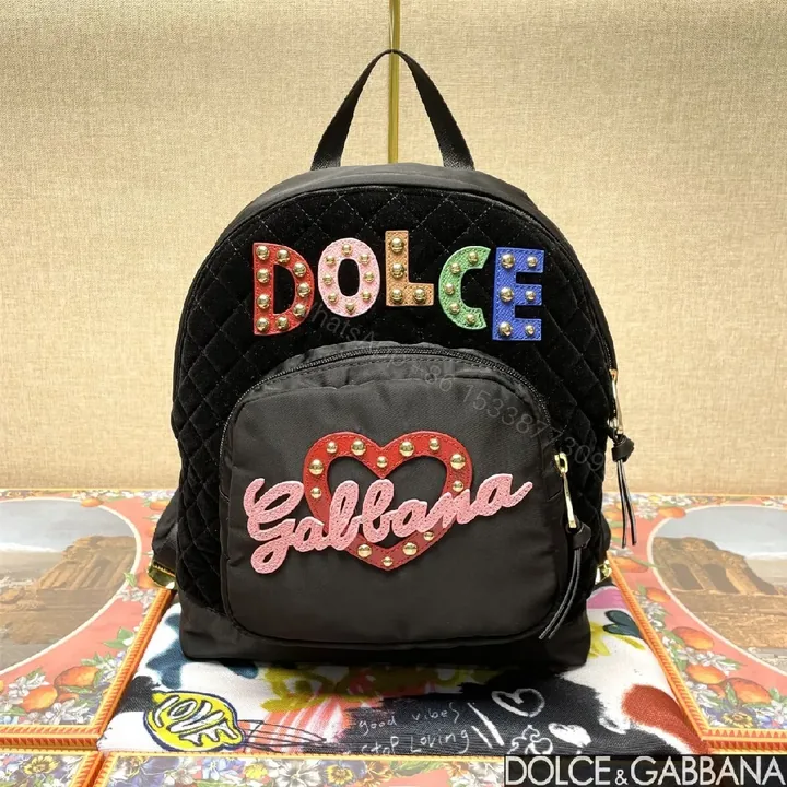 View 1 of Black Quilted Backpack with Colorful Logo Embellishments, All-Day Comfort