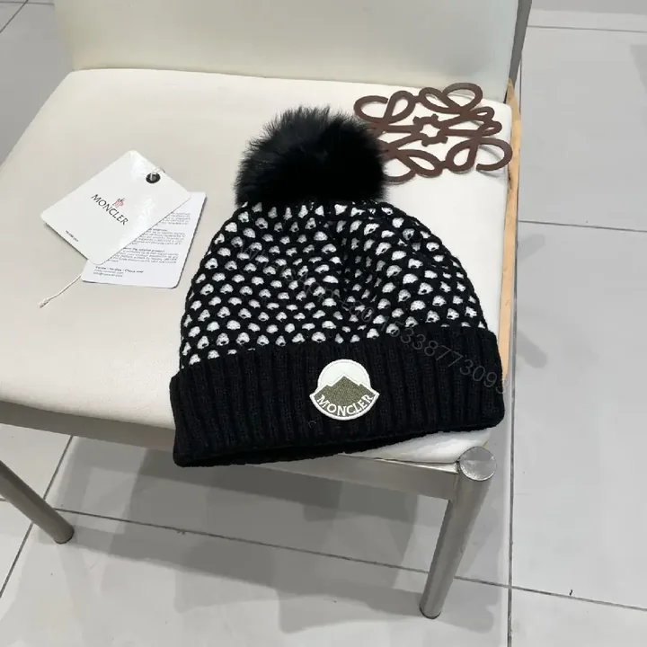 View 1 of Chic Knit Beanie: Textured Warmth with Pom Pom