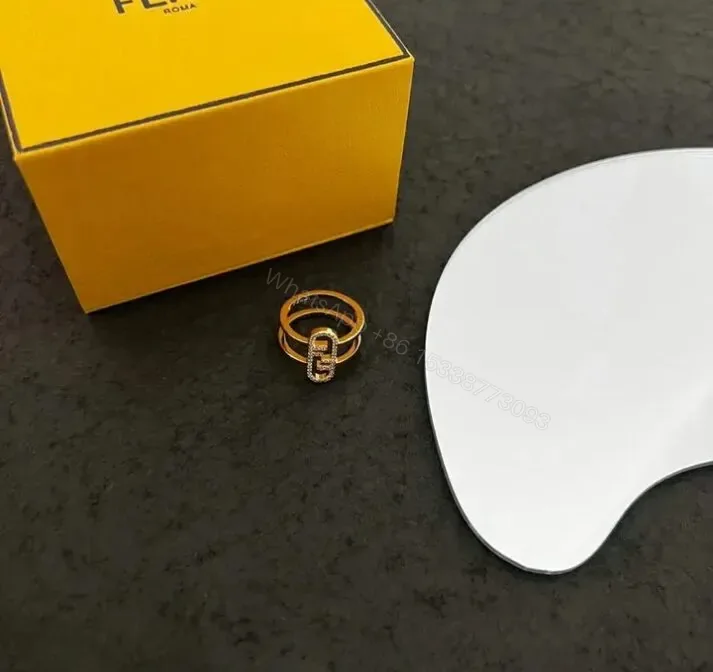 View 1 of Fendi Asymmetrical Gold Ring Mirror qj90674