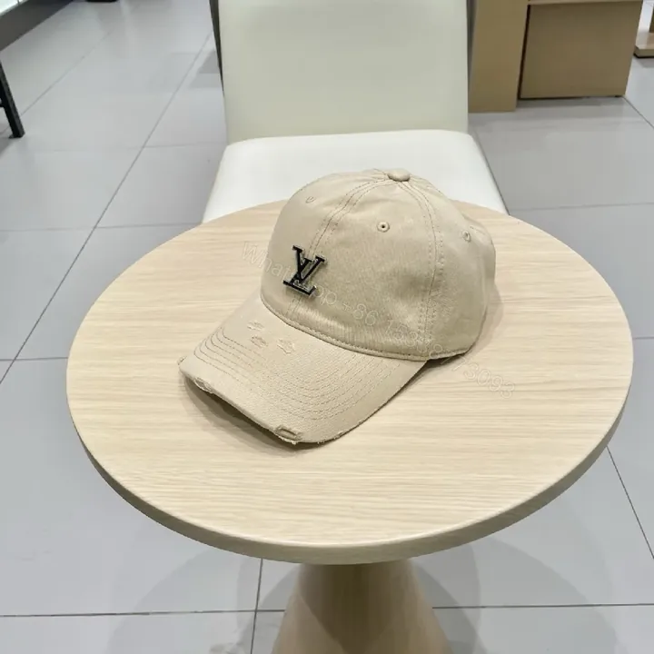 View 1 of Beige Cap with Textured Panels, Subtle LV-Inspired Emblem, Casual Luxury