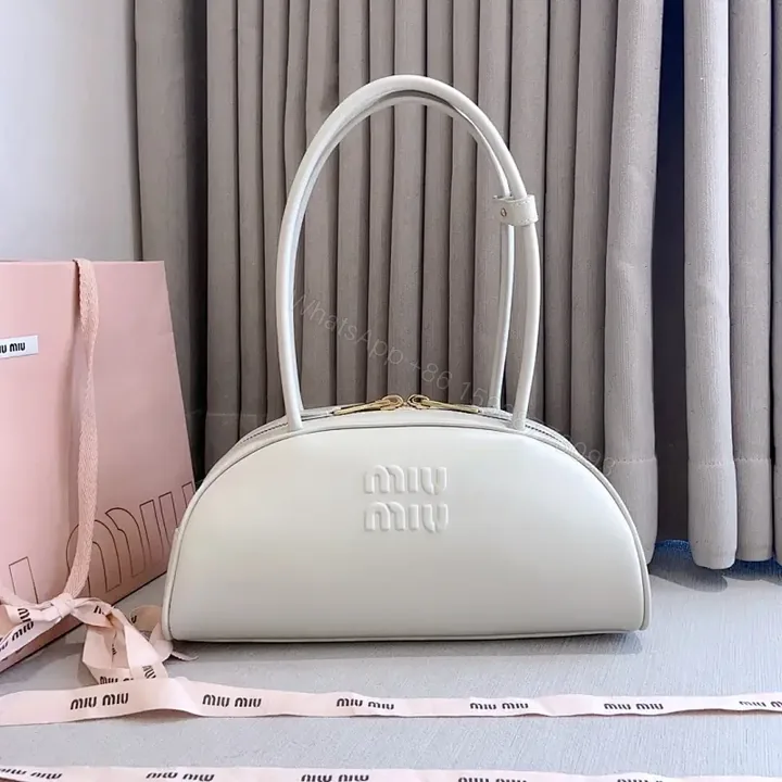 View 1 of Light Leather Dome Bag in Soft Hue, Compact Day-to-Night Carry
