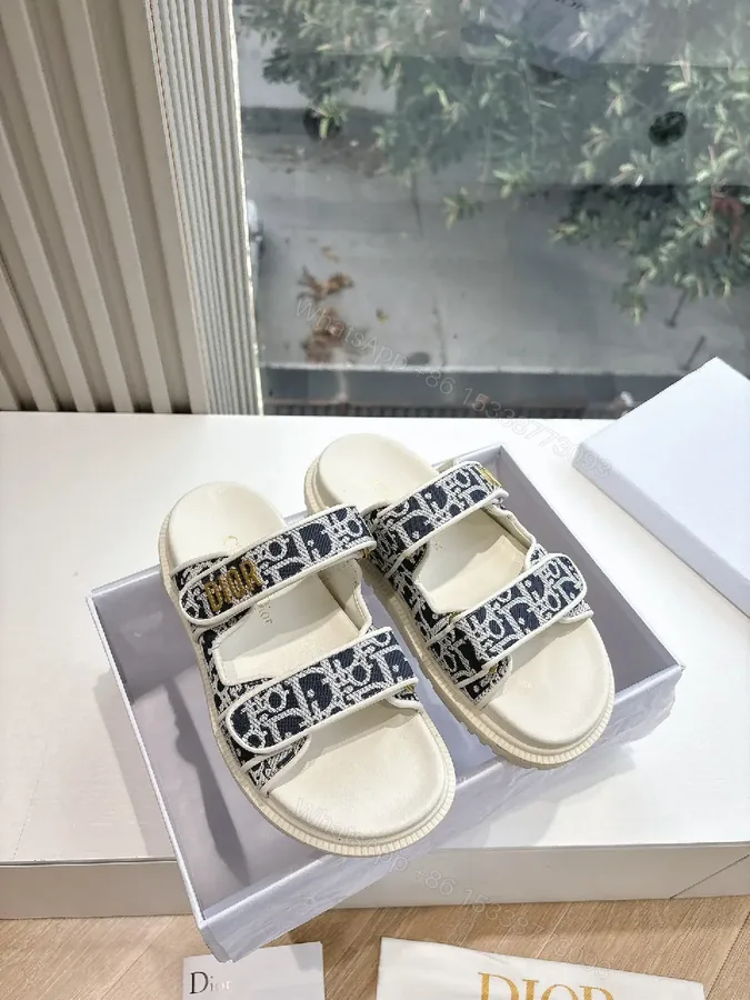View 1 of Navy Ivory Patterned Platform Sandals with Logo Straps