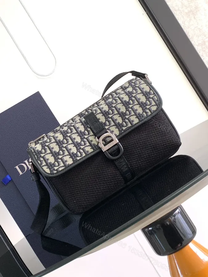 View 1 of Compact Luxury Crossbody Bag: Monogram Mesh Panel, Sleek