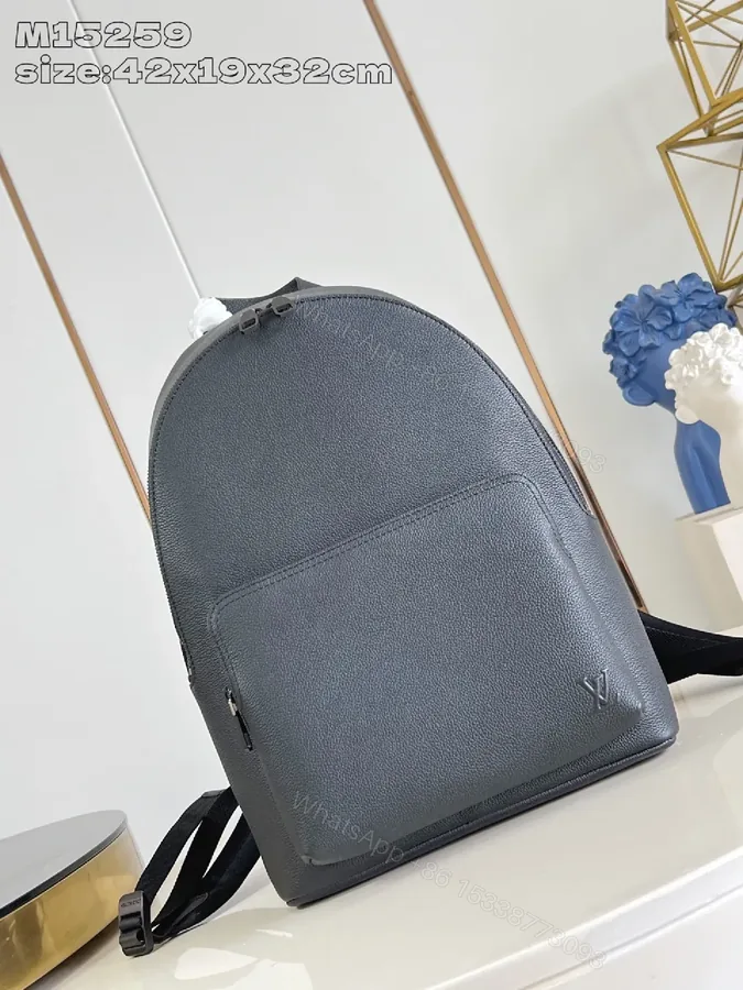 View 1 of Gray Leather Compact Backpack: Minimalist Luxury, Subtle Branding, Everyday Organizer