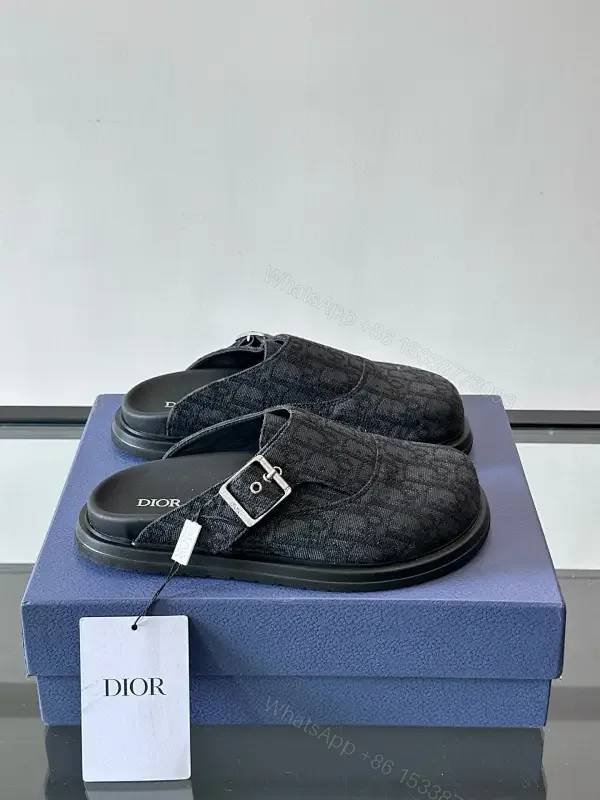 View 1 of Dark Monogram Slip-Ons: Textured Mules with Subtle Buckle
