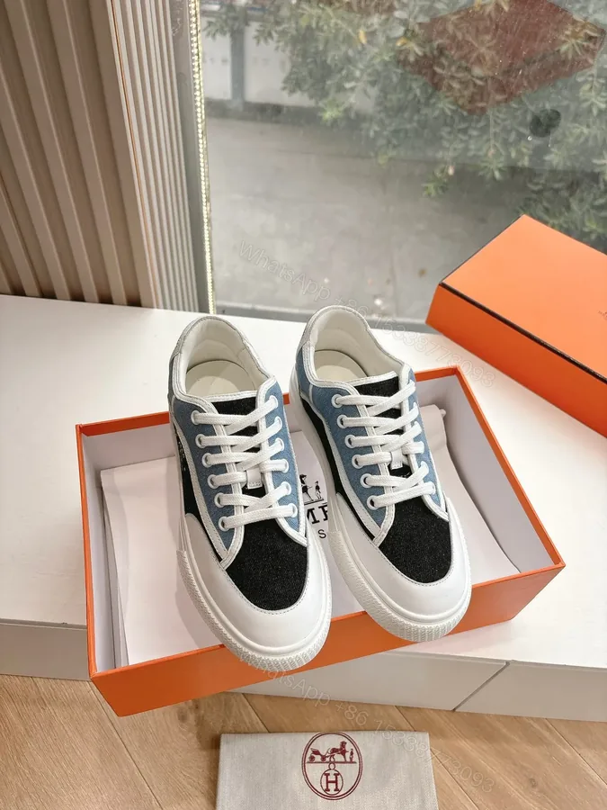 View 1 of Hermes Women Black Blue Canvas And Leather Sneakers