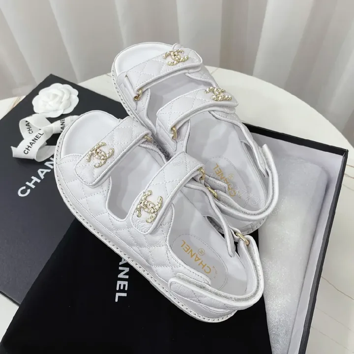 View 1 of White Quilted Leather Sandals with Gold Logo Hardware
