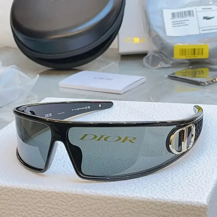 View 1 of Black Frame Sunglasses: Futuristic Wraparound, Dior Gold Logo Lenses