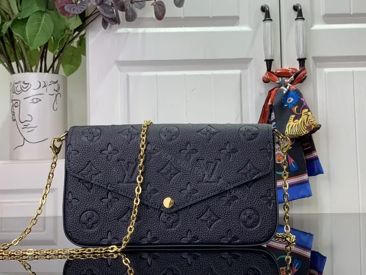 View 1 of Chic Leather Crossbody: Monogram Texture, Gold Hardware, Compact Envelope
