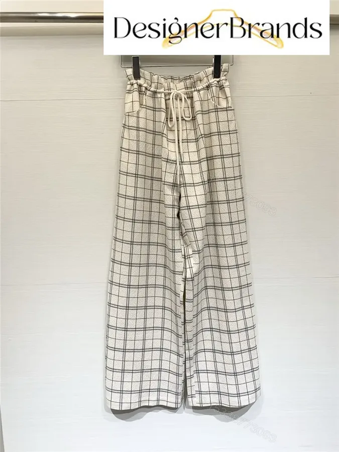 View 1 of Acne Studios Off-White Drawstring High-Waisted Wide-Leg Trousers