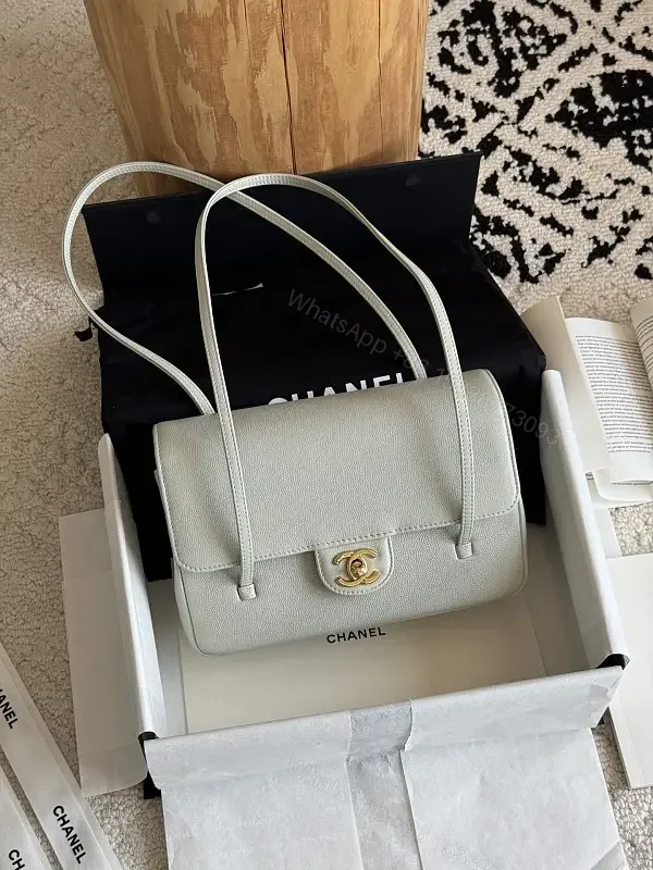 View 1 of Light Gray Pebbled Leather Structured Handbag with Gold Turn-Lock Clasp