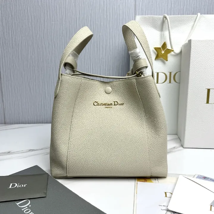 View 1 of Pebbled Leather Minimalist Bucket Bag - All-Day Luxury
